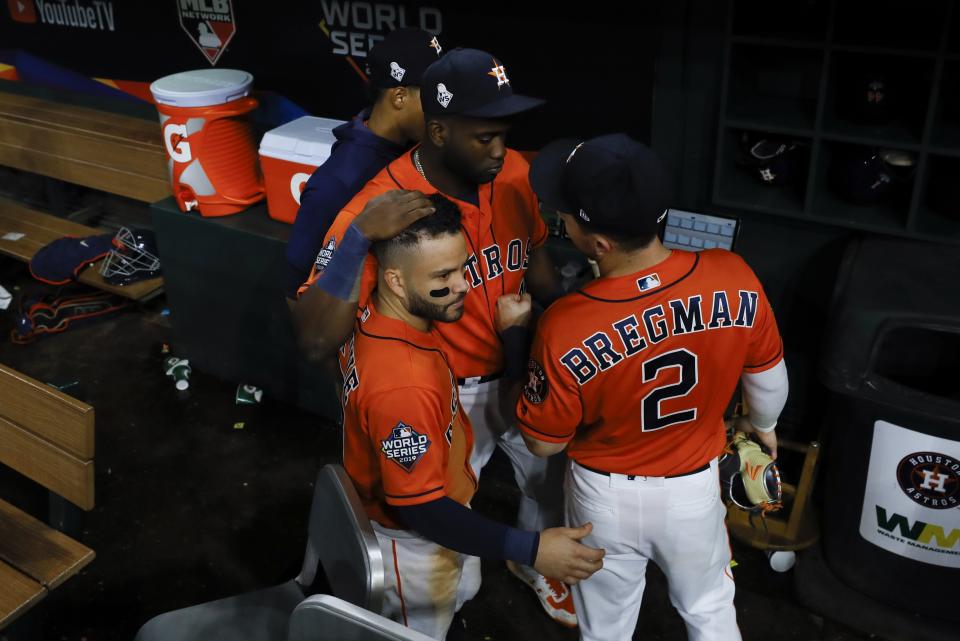 Houston Astros' Yordan Alvarez, Alex Bregman and Jose Altuve huddle after Game 7 of the baseball World Series against the Washington Nationals Wednesday, Oct. 30, 2019, in Houston. The Nationals won 6-2 to win the series. (AP Photo/Matt Slocum)