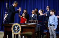 <p>President Barack Obama high-fives eight-year-old Hinna Zejah after unveiling a series of gun control proposals during an event at the White House in Washington, January 16, 2013. Hinna and her mother Nadia (BehindL) was among a group of children and families of children who wrote the president letters about guns and gun control after the December 14 school shooting in Newtown, Connecticut, in which 20 children and six adults were killed. (Jason Reed/Reuters) </p>