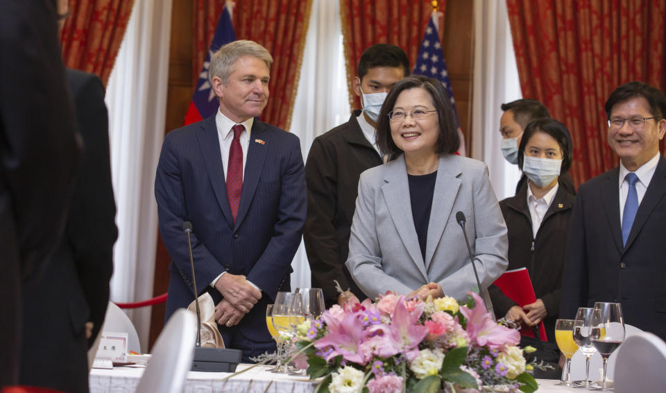 In this photo released by the Taiwan Presidential Office, House Foreign Affairs Committee Chairman Michael McCaul, R-Texas, left, attends a luncheon with Taiwan's President Tsai Ing-wen, during a visit by a Congressional delegation to Taiwan in Taipei, Taiwan, Saturday, April 8, 2023. China sent warships and dozens of fighter jets toward Taiwan on Saturday, the Taiwanese government said, in retaliation for a meeting between the U.S. House of Representatives speaker and the president of the self-ruled island democracy claimed by Beijing as part of its territory. (Taiwan Presidential Office via AP)