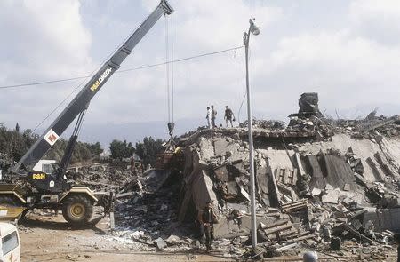 A crane is brought in after the explosion of the Marine Corps building in Beirut, Lebanon October 23, 1983. REUTERS/US Marines/Handout via REUTERS