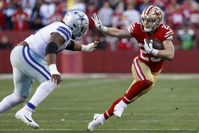 SANTA CLARA, CA - DECEMBER 04: San Francisco 49ers running back Christian  McCaffrey (23) lunges for extra yards during the NFL professional football  game between the Miami Dolphins and San Francisco 49ers