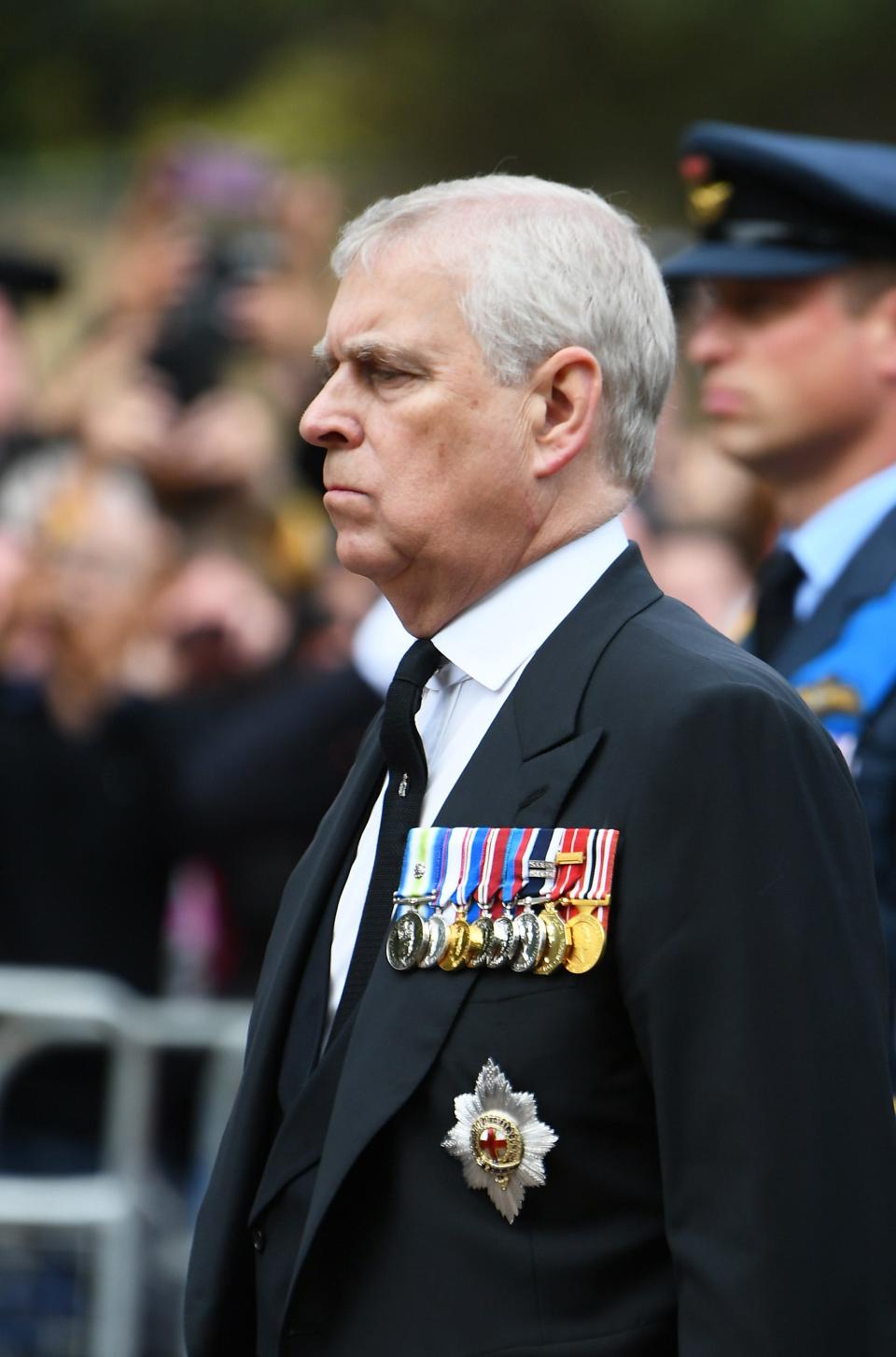 Prince Andrew, Duke of York, follows behind the queen's funeral cortege borne on the State Gun Carriage of the Royal Navy on Sept. 19, 2022.