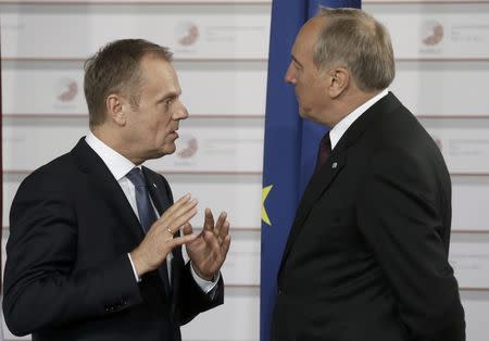 Latvian President Andris Berzins welcomes European Council President Donald Tusk (L) at the Eastern Partnership Summit in Riga, Latvia, May 21, 2015. REUTERS/Ints Kalnins