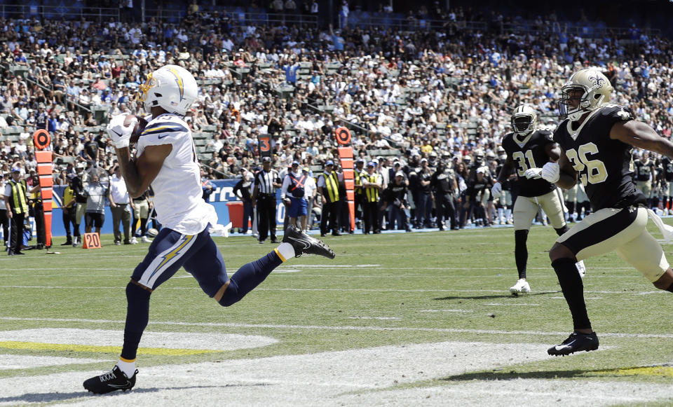 Los Angeles Chargers wide receiver Andre Patton, left, makes a touchdown reception against the New Orleans Saints during the first half of a preseason NFL football game Sunday, Aug. 18, 2019, in Carson, Calif. (AP Photo/Gregory Bull)