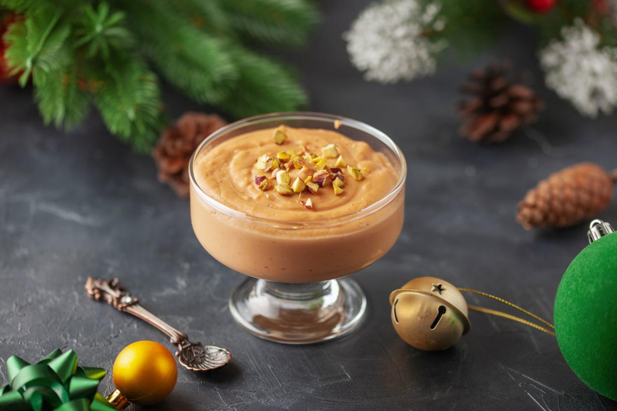 Homemade butterscotch pudding in glass cream bowl on the table. National Butterscotch Pudding Day