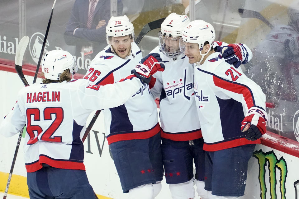 Washington Capitals right wing Garnet Hathaway (21) celebrates after scoring a goal during the first period of an NHL hockey game against the New Jersey Devils, Saturday, Feb. 27, 2021, in Newark, N.J. (AP Photo/Mary Altaffer)