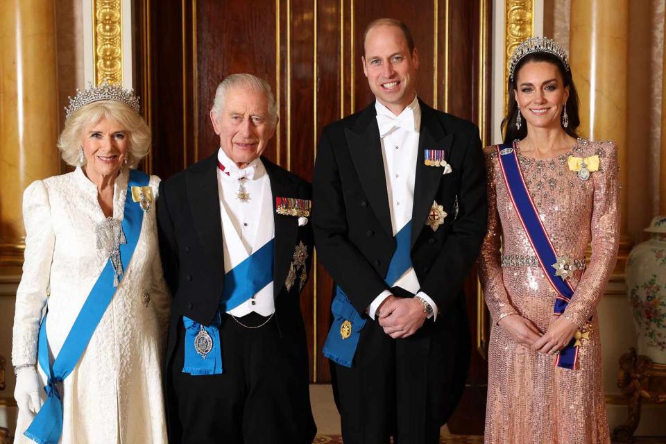 <p>Chris Jackson/Getty</p> Queen Camilla, King Charles, Prince William and Kate Middleton pose for a photo before the Diplomatic Reception at Buckingham Palace on Dec. 5, 2023.