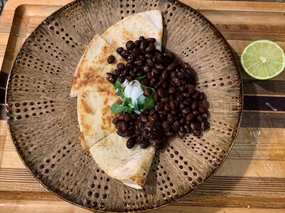 quesadilla with black beans and a lime