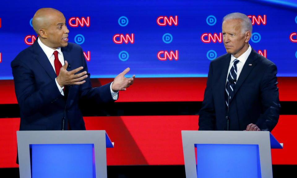 In this July 31, 2019 file photo, Sen. Cory Booker, D-N.J., gestures to former Vice President Joe Biden during the second of two Democratic presidential primary debates hosted by CNN in the Fox Theatre in Detroit.   (AP Photo/Paul Sancya)