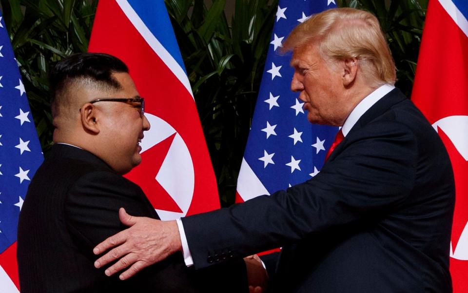 President Donald Trump meets with North Korean leader Kim Jong Un on Sentosa Island, Tuesday, June 12, 2018, in Singapore - AP