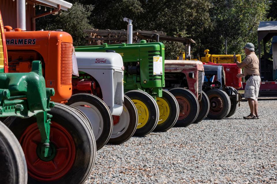 Jack Funamura, of Morada, takes photos of the parked tractors at the San Joaquin County Tractor Fest on Saturday, Oct. 15, 2022, at the San Joaquin County Historical Museum in Micke Grove Park in Lodi. 