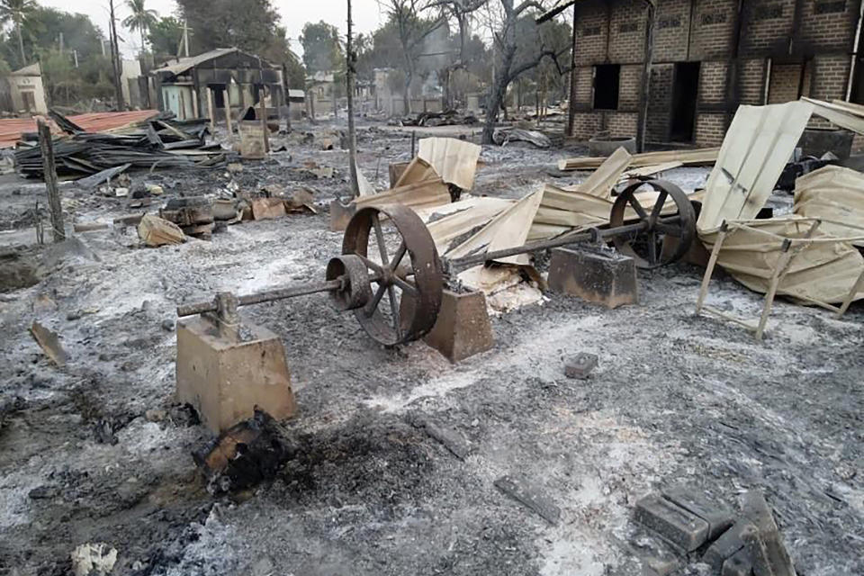 FILE - Charred homes sit in piles of ash in Mwe Tone village of Pale township, in the Sagaing region, Myanmar, on Feb. 1, 2022. A report by a U.N. expert on human rights charges that Thai banks have become the main supplier of cross-border financial services for Myanmar’s military government, enabling its purchases of goods and equipment used to carry out its increasingly bloody war against pro-democracy resistance forces and armed ethnic minority groups. (AP Photo, File)