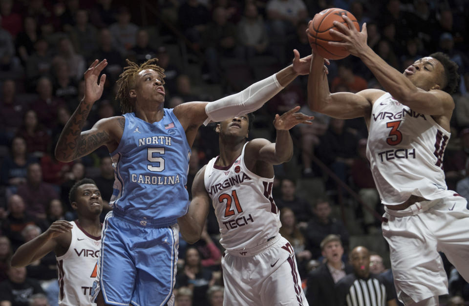 Virginia Tech guard Wabissa Bede (3) controls the rebound in front of North Carolina forward Armando Bacot (5) during the first half of an NCAA college basketball game in Blacksburg, Va., Wednesday, Jan. 22, 2020.(AP Photo/Lee Luther Jr.)