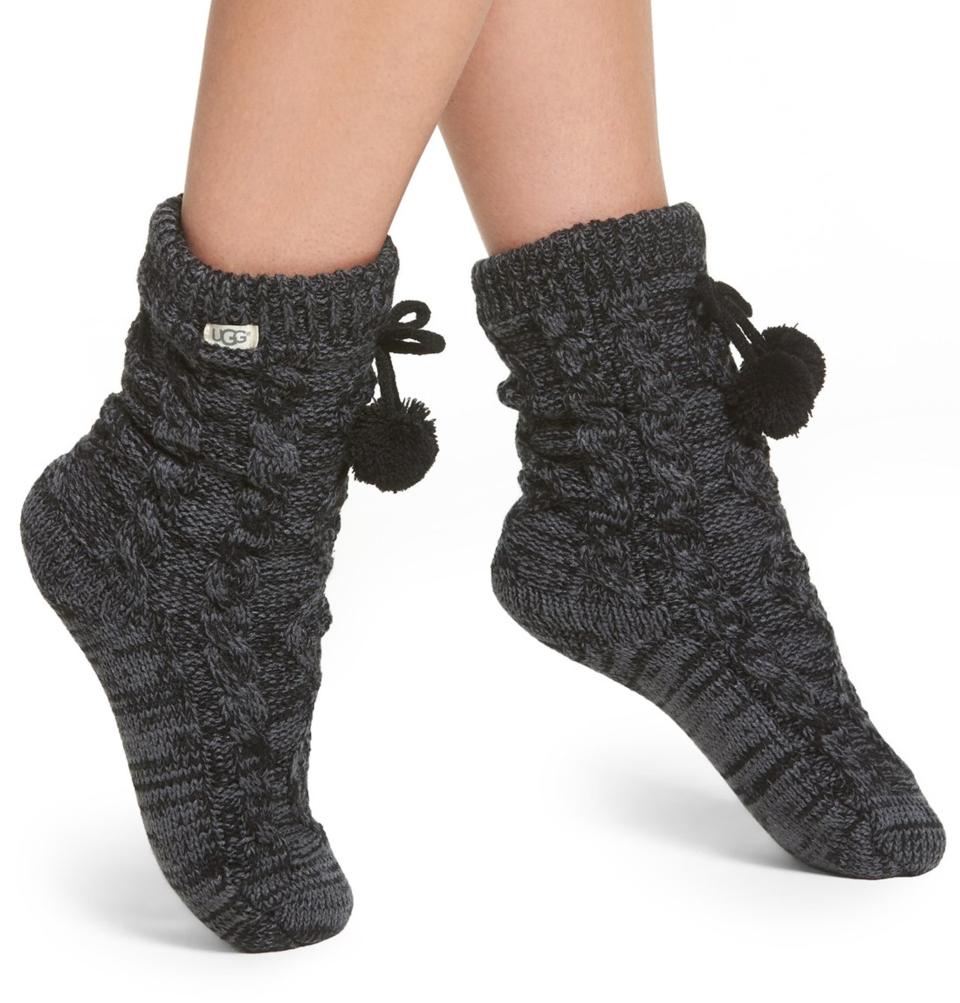 Fleece-lined, chunky cable-knit, pom-pommed Ugg slipper-socks. Need we say more? (Photo: Nordstrom) 