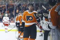 Philadelphia Flyers' Ivan Provorov celebrates with teammates after scoring a goal during the first period of an NHL hockey game against the Carolina Hurricanes, Thursday, March 5, 2020, in Philadelphia. (AP Photo/Matt Slocum)
