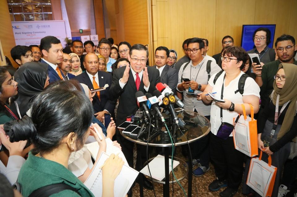 Finance Minister Lim Guan Eng speaks to reporters after the MoU signing ceremony between SME bank, MRL and CCC-ECRL in Kuala Lumpur November 18, 2019.