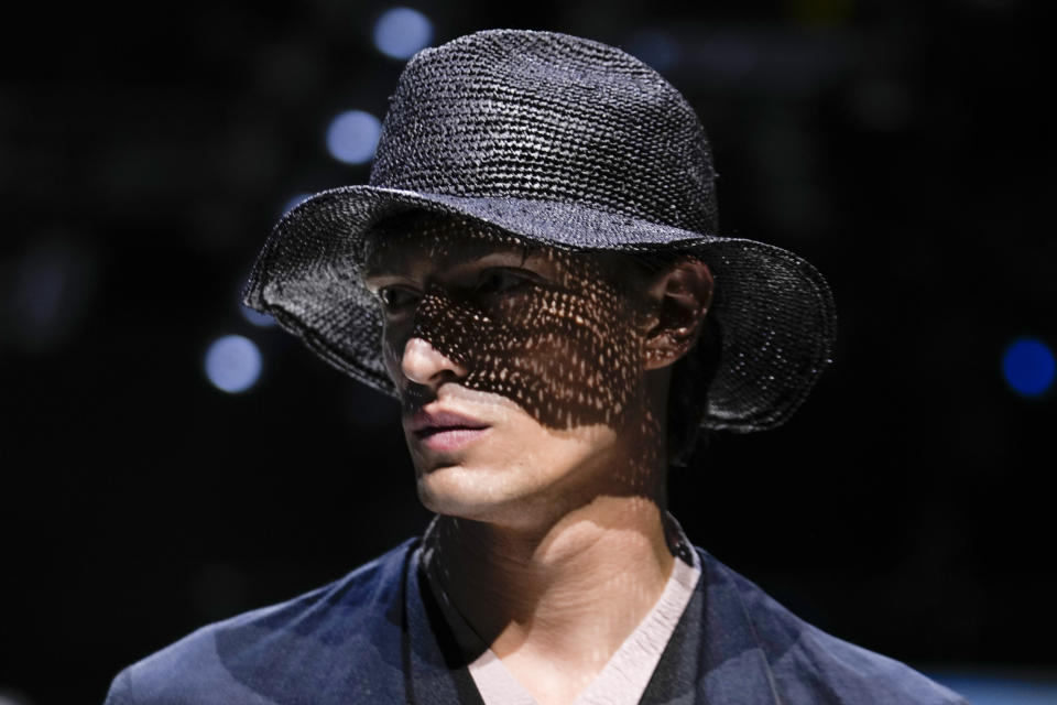A model wears a creation as part of the Giorgio Armani Men's Spring Summer 2025 collection, that was presented in Milan, Italy, Monday, June 17, 2024. (AP Photo/Luca Bruno).