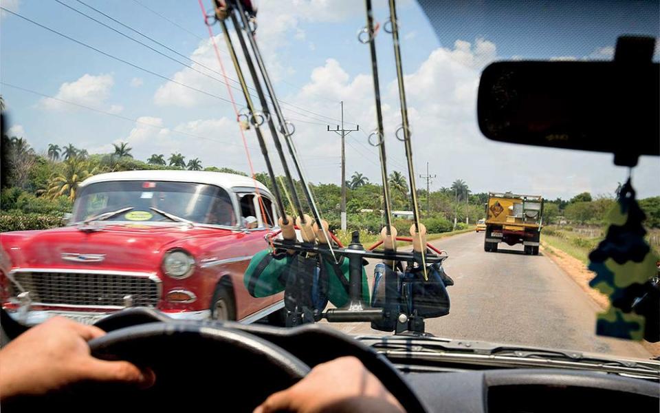 Fly rods strapped to a car en route to Playa Larga, an angler’s destination.