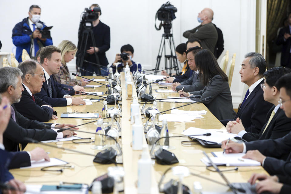 In this photo released by Russian Foreign Ministry Press Service, Russian Foreign Minister Sergey Lavrov, 2nd left, speaks with Chinese Foreign Minister Wang Yi, 3rd right, during their talks in Moscow, Russia, Monday, Sept. 18, 2023. (Russian Foreign Ministry Press Service via AP)