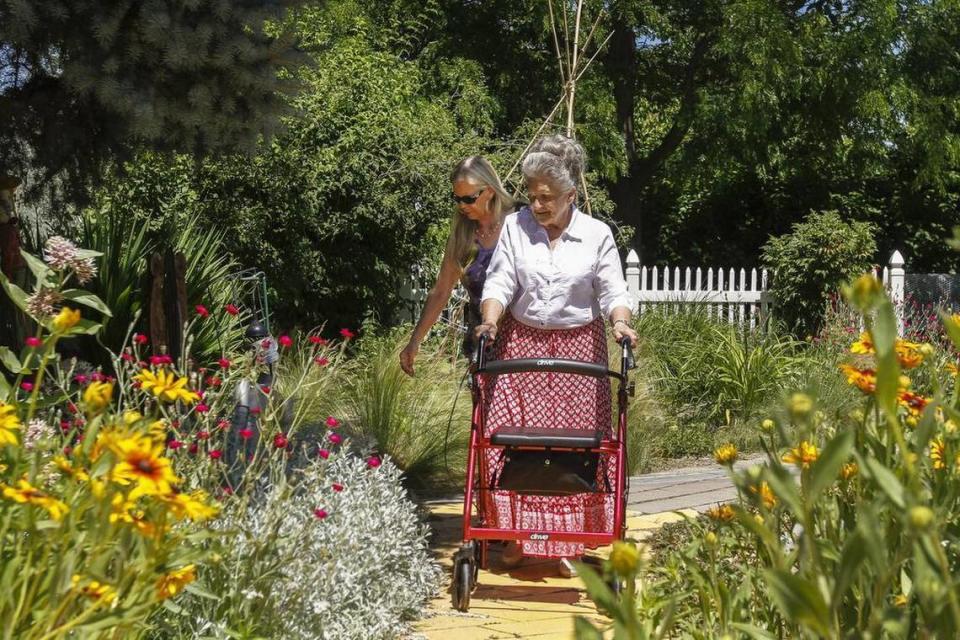 July 22, 2017 - Friends Rita Burns, left, and Pat Stark enjoy the Demonstration Garden at Highlands Grange Park on Union Street in Kennewick on Wednesday afternoon. The National Weather Service expects Thursday will continue to be mostly sunny, with daytime highs near 83 in the Tri-Cities.