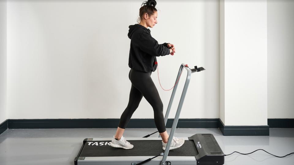 Image of woman walking on the Bluefin Fitness Task 2.0 Treadmill