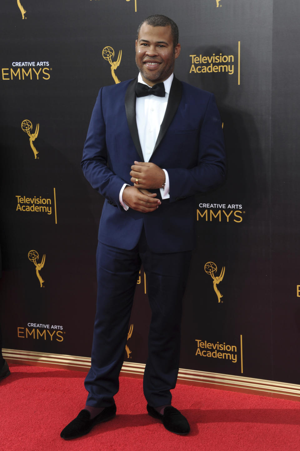 FILE - Jordan Peele arrives at night two of the Creative Arts Emmy Awards on Sunday, Sept. 11, 2016, in Los Angeles. Parties are back, and they've brought with them the potential for some dress code chaos. White tie, black tie, black tie creative/festive, semi-formal. Pre-pandemic guidelines for attire in an exhausted world more used to sweats and sneakers may take some extra re-entry energy. (Photo by Richard Shotwell/Invision/AP, File)