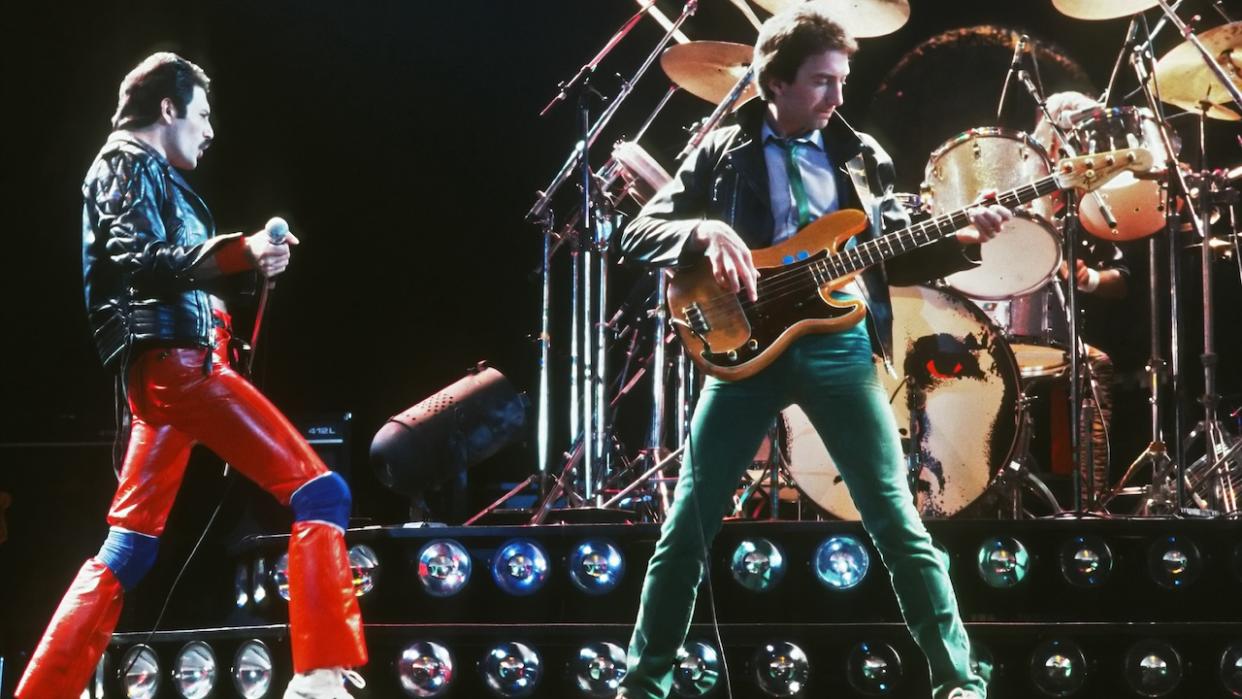  Freddie Mercury (1946 - 1991) and musician John Deacon of British rock band Queen in concert, 1980. . 