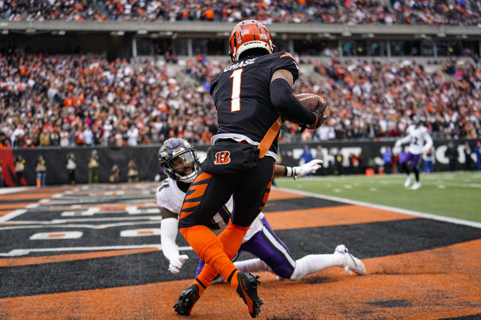 Cincinnati Bengals wide receiver Ja'Marr Chase (1) makes a catch in front of Baltimore Ravens cornerback Daryl Worley (41) for a touchdown in the first half of an NFL football game in Cincinnati, Sunday, Jan. 8, 2023. (AP Photo/Joshua A. Bickel)