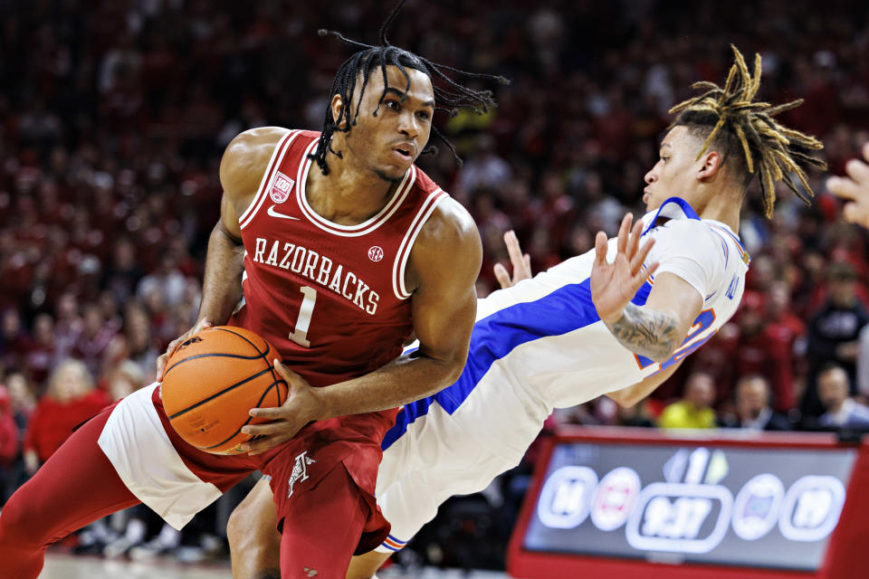 FAYETTEVILLE, ARKANSAS – FEBRUARY 18: Ricky Council IV #1 of the Arkansas Razorbacks drives to the basket in the first half and is called for a charge against Riley Kugel #24 of the <a class="link " href="https://sports.yahoo.com/ncaab/teams/florida/" data-i13n="sec:content-canvas;subsec:anchor_text;elm:context_link" data-ylk="slk:Florida Gators;sec:content-canvas;subsec:anchor_text;elm:context_link;itc:0">Florida Gators</a> at Bud Walton Arena on February 18, 2023 in Fayetteville, Arkansas. (Photo by Wesley Hitt/Getty Images)