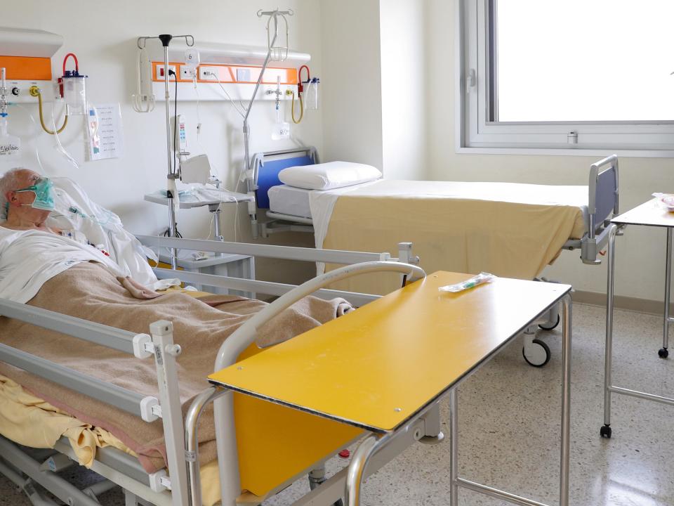 FILE PHOTO: A patient suffering from the coronoavirus disease (COVID-19) is seen at the San Filippo Neri hospital in Rome, Italy, March 30, 2020. REUTERS/Guglielmo Mangiapane/File Photo