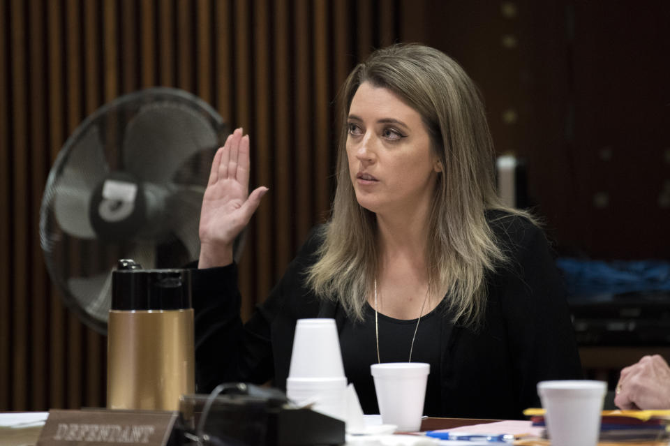 Kate McClure appears in court Monday, April 15, 2019 at Burlington County Superior Court in Mount Holly, N.J. McClure pleaded guilty to a state charge in a 'good Samaritan' scam of GoFundMe donors and faces a potential four-year prison term. (Joe Lamberti/Camden Courier-Post via AP, Pool)