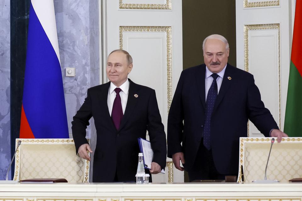 Russian President Vladimir Putin, left, and Belarus President Alexander Lukashenko arrive to attend a meeting of the Union State Supreme Council in St. Petersburg, Russia, Monday, Jan. 29, 2024. (Dmitry Astakhov, Sputnik, Government Pool Photo via AP)