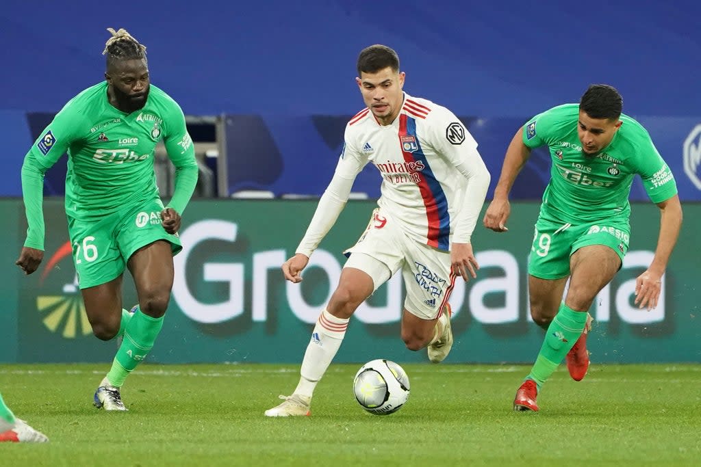 Lyon midfielder Bruno Guimaraes, centre, has been linked with Newcastle (Laurent Cipriani/PA) (AP)