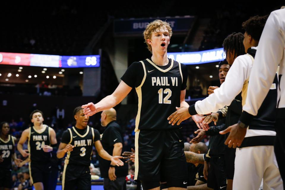 Senior Forward Garrett Sundra of Paul VI Catholic (Virginia) high-fives his teammates during the championship game of the Tournament of Champions against St. John Bosco (California) at Great Southern Bank Arena on Saturday, Jan. 13, 2024.