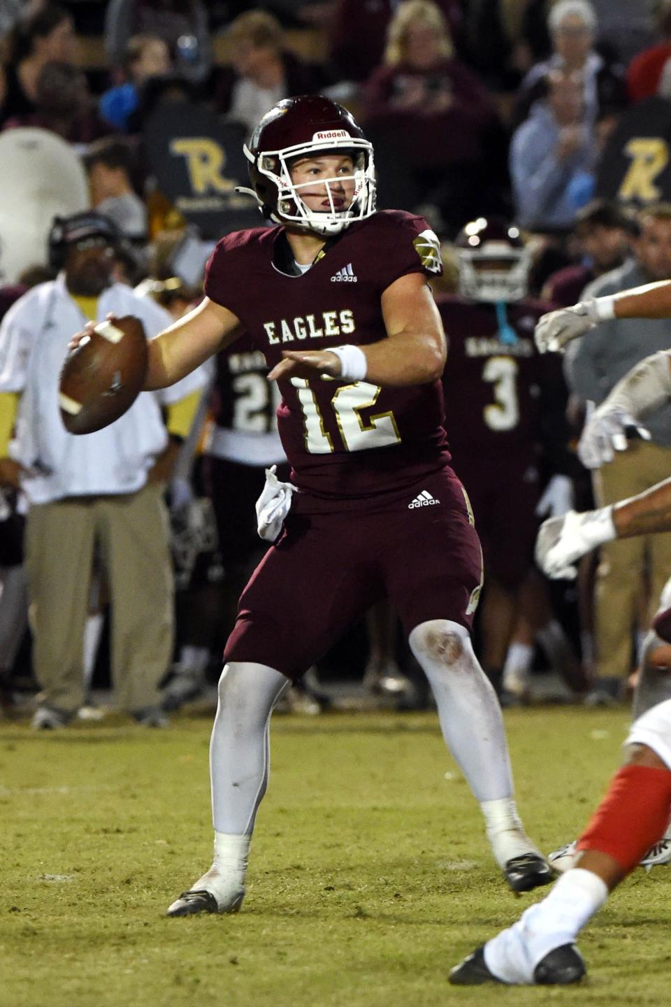 Niceville High School quarterback Harrison Orr looks downfield to pass  during the Eagles playoff game against Crestview High School on Friday, Nov. 11, 2022.