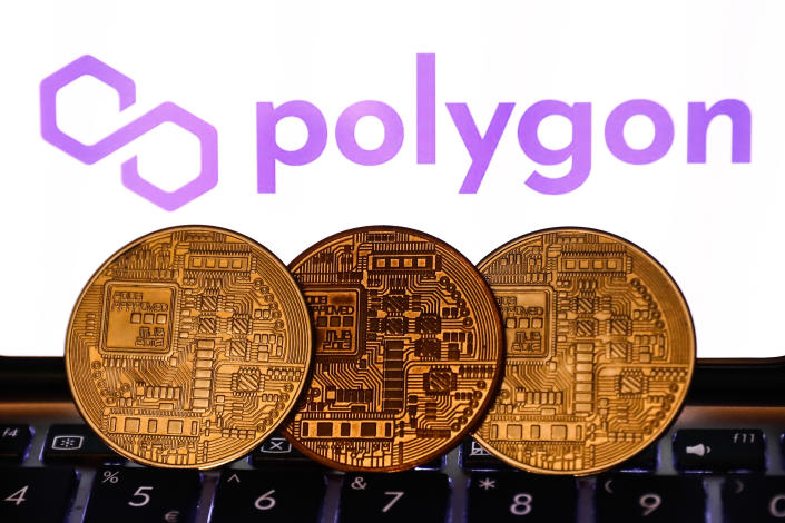 The Crypto Mile: Polygon logo displayed on a phone screen and representation of cryptocurrency are seen in this illustration photo taken in Krakow, Poland on November 6, 2021. (Photo by Jakub Porzycki/NurPhoto via Getty Images)