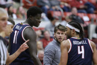 Arizona guard Kylan Boswell (4), center Oumar Ballo (11) and guard Kerr Kriisa, left, walk on the court near the end of the second half of the team's NCAA college basketball game against Washington State, Thursday, Jan. 26, 2023, in Pullman, Wash. Arizona won 63-58. (AP Photo/Young Kwak)