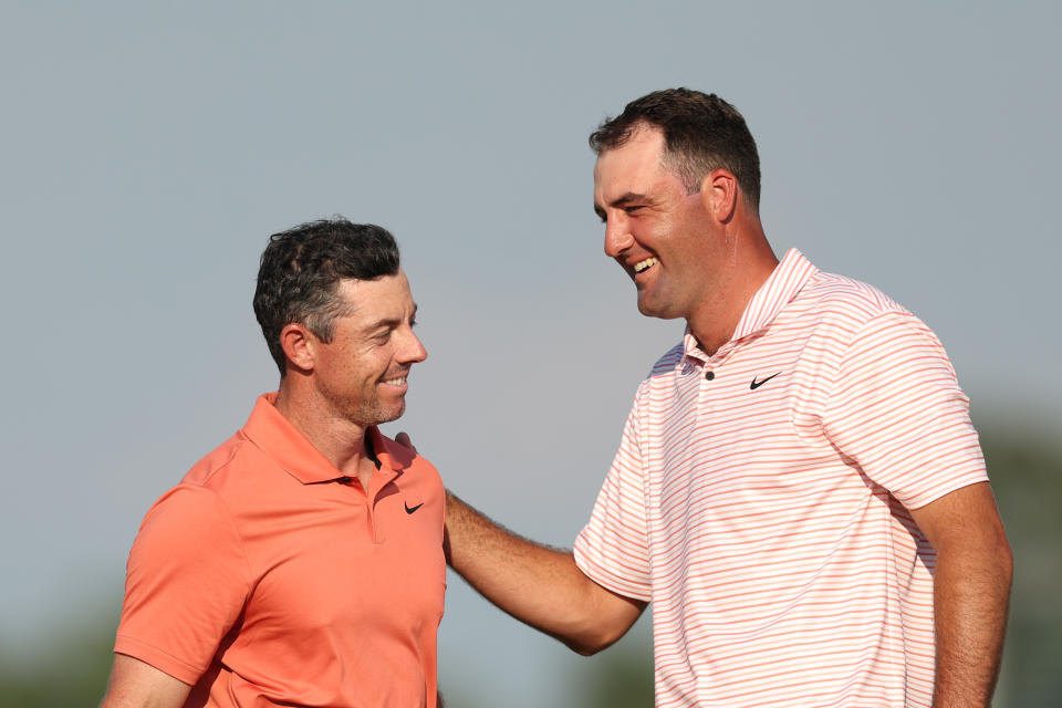 PINEHURST, NORTH CAROLINA - JUNE 13: Rory McIlroy of Northern Ireland and Scottie Scheffler of the United States speak on the 18th green after completing their round during the first round of the 124th US Open at Pinehurst Resort on June 13, 2024 in Pinehurst, North Carolina.  (Photo by Sean M. Haffey/Getty Images)