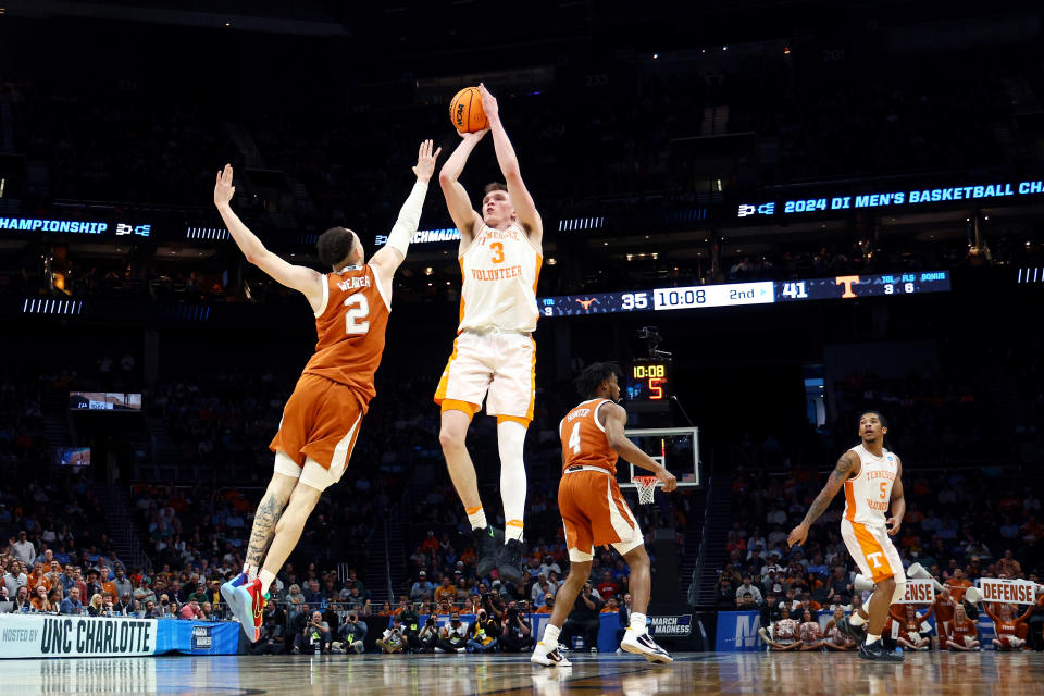 CHARLOTTE, NORTH CAROLINA - MARCH 23: Dalton Knecht #3 of the Tennessee Volunteers shoots the ball against Chendall Weaver #2 of the Texas Longhorns during the second half in the second round of the NCAA Men's Basketball Tournament at Spectrum Center on March 23, 2024 in Charlotte, North Carolina. (Photo by Jared C. Tilton/Getty Images)