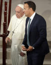 Pope Francis talks with Irish Prime Minister Leo Varadkar during their meeting, in Dublin, Ireland, Saturday, Aug. 25, 2018. Pope Francis is on a two-day visit to Ireland. (AP Photo/Gregorio Borgia)