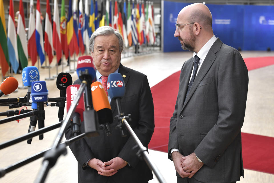 European Council President Charles Michel, right, and United Nations High Commissioner for Refugees Antonio Guterres speak with the media as they arrive for an EU summit at the European Council building in Brussels, Thursday, March 23, 2023. European Union leaders meet Thursday for a two-day summit to discuss the latest developments in Ukraine, the economy, energy and other topics including migration. (AP Photo/Geert Vanden Wijngaert)