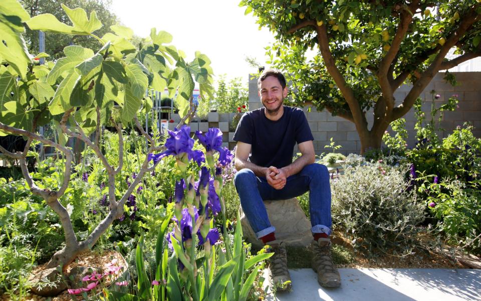 Tom Massey is seen in the Show garden he designed for the Lemon Tree Trust, during build up week at the RHS Chelsea Flower Show 2018,  - Clara Molden