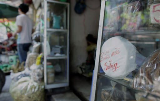 A ceramic grinding plate for rhino horn (R, white) is for sale at a traditional medicine shop in Hanoi. An explosion in Asian demand for horn saw a record 448 rhinos poached in South Africa last year -- compared with just 13 in 2007 -- and the rate is increasing, with over 170 killed so far this year