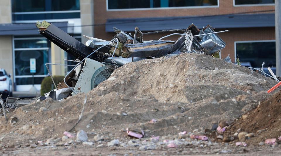 Demolition debris is piled at the lot where the former Manitowoc Visitor Center was located as seen, Thursday, September 28, 2023, in Manitowoc, Wis. Crews are working on cleaning the lot up after the building’s demolition.