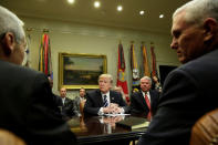 U.S. President Donald Trump (C) and Vice President Mike Pence (R) meet with Pharma industry representatives at the White House in Washington, U.S., January 31, 2017. REUTERS/Yuri Gripas