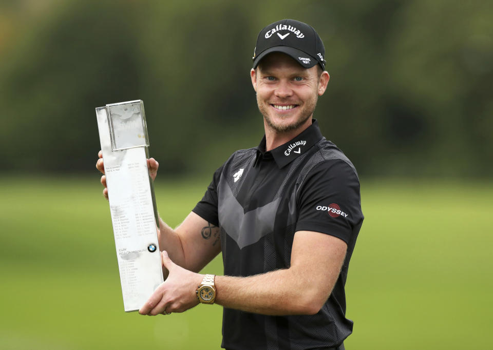 England's Danny Willett poses with the trophy after winning the PGA Championship at Wentworth Golf Club, Wentworth, England, Sunday Sept. 22, 2019. (Bradley Collyer/PA via AP)