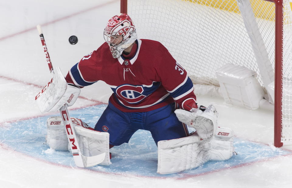 Montreal Canadiens goaltender Carey Price gives up a goal to Tampa Bay Lightning's Steven Stamkos during the first period of an NHL hockey game Thursday, Jan. 2, 2020, in Montreal. (Graham Hughes/The Canadian Press via AP)