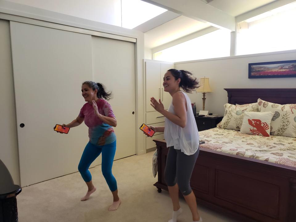 Kat Vasquez (right) is getting a Wii workout with her mom. (Photo: Kat Vasquez)