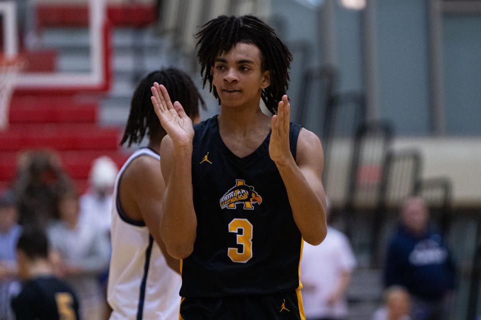 Avon Orioles sophomore Jedidiah Minnett claps his hands after scoring Jan 5, 2024, at Plainfield High School in Plainfield, Indiana.