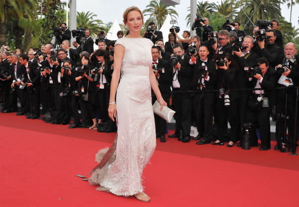 <p>Uma teamed her glitzy dress with sandals at the 2011 ‘Pirates Of The Caribbean’ premiere in Cannes. <i>[Photo: Getty]</i></p>